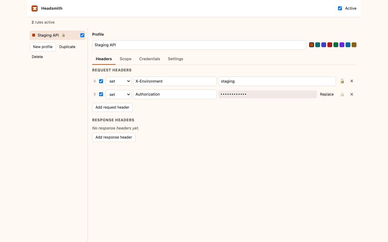 The header editor showing an X-Environment header set to staging and an Authorization header whose value is masked.